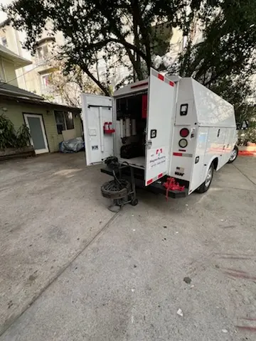 Magnet Plumbing service vehicle on-site for Grease Trap Cleaning in Zimmerman Terrace